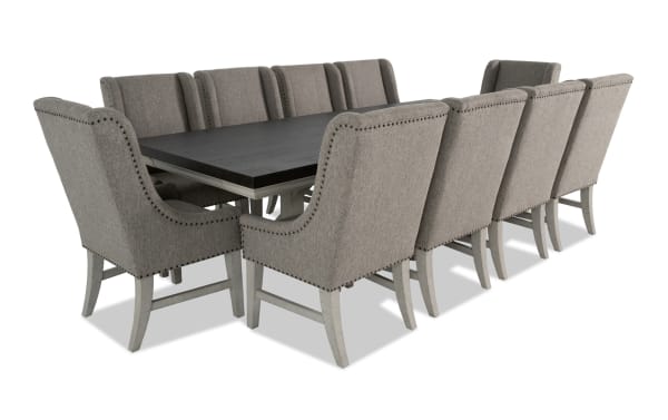 Beaumont 11-piece beige transitional dining set with extendable pine wood table, fabric-upholstered memory foam chairs, and nailhead trim.