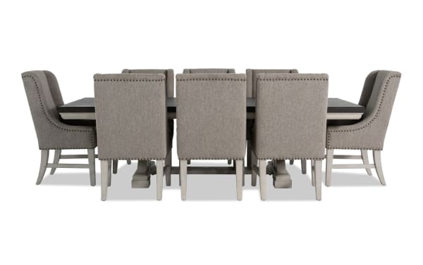 Beaumont 9 Piece Beige Upholstered Extendable Dining Set with pine solids, polyester fabric, nailhead trim, memory foam chairs, and felt-lined storage drawers.
