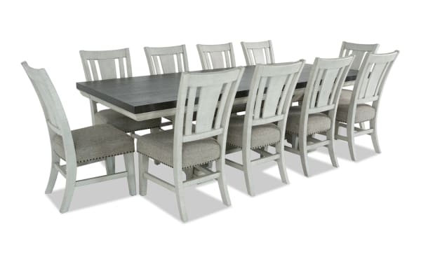 Beaumont 11 Piece Transitional Dining Set with beige upholstered polyester fabric chairs, pine solids table with extendable brown top and storage drawers.