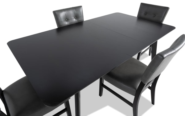 Bettie 5 Piece Black & Charcoal Faux Leather Upholstered Dining Set with mid-century modern style, MDF and walnut veneers, flared legs, and memory foam seats.