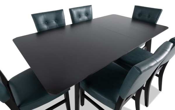 Bettie 7 Piece Dining Set with black MDF table and teal faux leather upholstered chairs, mid-century modern style with flared legs and memory foam seats.