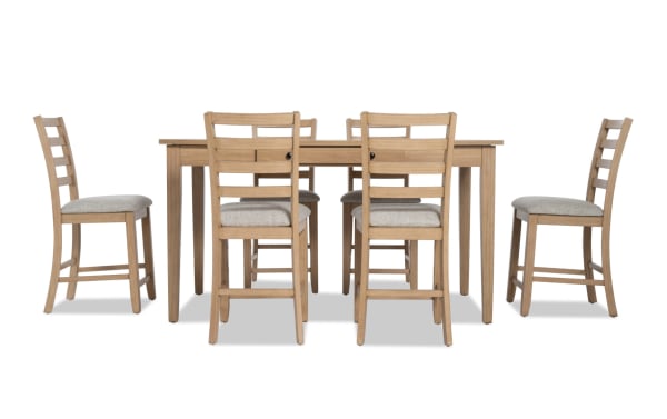 Homeworks 7 Piece Natural & Gray Counter Height Dining Set with lift-top storage table, six gray fabric-upholstered ladder back stools, transitional style, rubberwood frame, and melamine finish.
