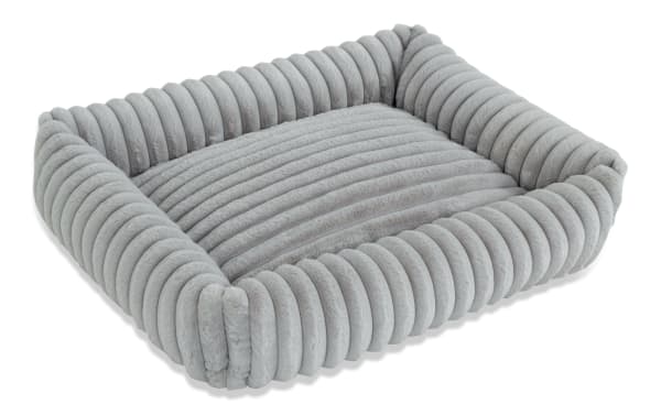 Contemporary Sofia Gray Pup-O-Pedic Medium Pet Bed with plush gray polyester fabric, channel tufted cushion, and memory foam support.