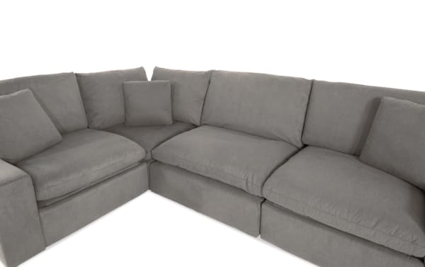 Dream Gray 131'' power reclining 4-piece modular sectional in gray polyester fabric with power headrests, 2 recliners, armless chair, and corner.