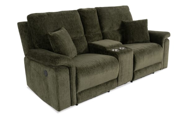 Renegade Green 88'' power reclining console loveseat in green polyester fabric, transitional style with padded arms, plush pillows, USB ports, cupholders, and hidden storage.