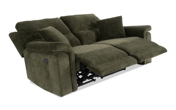 Renegade Green 75'' power reclining loveseat in green polyester fabric with plush pillows, padded arms, USB charging port, and transitional style.