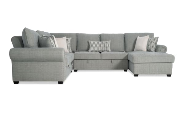 Light blue Playlist Max Spa 126'' 4-piece right arm facing chaise sectional in traditional style with polyester fabric upholstery, accent pillows, and built-in USB/USB-C ports.