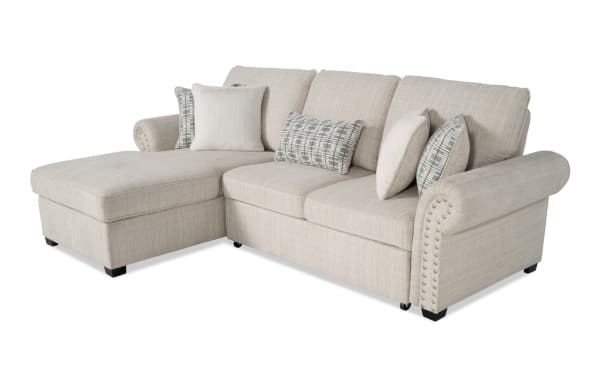 Playlist Max Beige 97'' 2-piece left arm facing chaise sectional in traditional style, beige polyester fabric with accent pillows, pop-up sleeper, and built-in USB/USB-C ports for device charging.