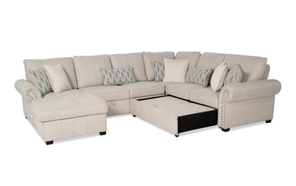 Playlist Max Beige 126'' 4-piece left arm chaise sectional with traditional beige polyester fabric, pop-up sleeper, armless storage loveseat, accent pillows, and built-in USB/USB-C ports for charging.