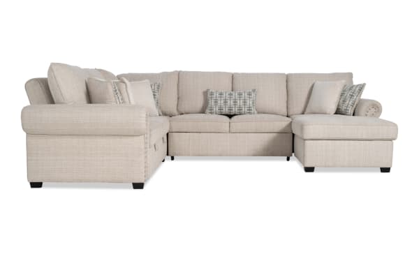 Playlist Max Beige 126'' 4-piece traditional fabric polyester sectional with right arm chaise, pop-up sleeper, storage loveseat, accent pillows, and built-in USB/USB-C ports.