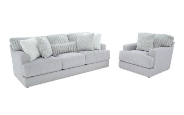 Contemporary Sofia Gray 93'' sofa and chair set in gray polyester fabric with channel tufted seat back cushions, accent pillows, and memory foam for comfort.
