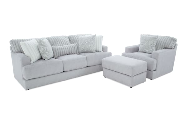 Contemporary Sofia Gray 93'' sofa, chair, and ottoman set in gray polyester fabric with channel tufted back cushions and accent pillows.