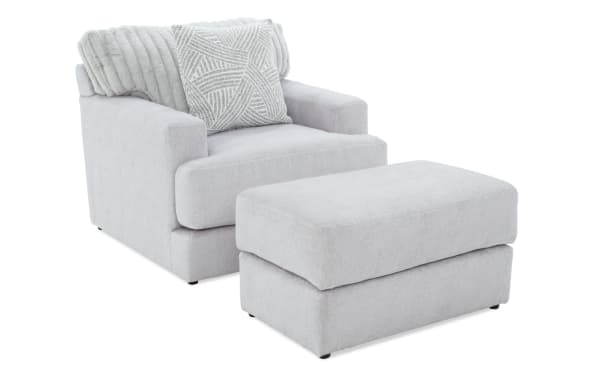 Contemporary Sofia Gray Chair & Ottoman set in gray polyester fabric with channel tufted back cushions and plush memory foam for living room comfort.