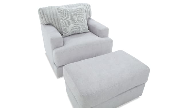 Contemporary Sofia Gray Chair & Ottoman set in gray polyester fabric with channel tufted back cushions and accent pillow, featuring Bob-O-Pedic Memory Foam for enhanced comfort.