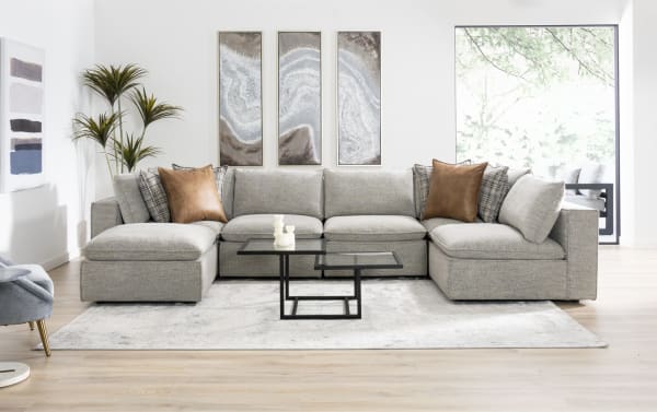 Infinity Gray 117'' 6-piece modular sectional in gray polyester fabric, transitional style with armless chairs, corners, media console, ottoman, and mixed accent pillows.