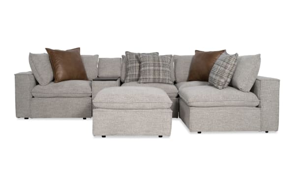 Infinity Gray 117'' 6-piece modular sectional in gray polyester fabric with 2 armless chairs, 2 corners, media console, and ottoman. Transitional style with Bob-O-Pedic® seats, feather-blend pillows, Bluetooth speakers, and removable cushions.