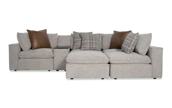 Infinity Gray 117'' 6-piece modular sectional in gray polyester fabric with two armless chairs, two corners, media console, ottoman, and mixed accent pillows. Transitional style with Bob-O-Pedic® seats, Bluetooth speakers, and removable cushions for customizable comfort.