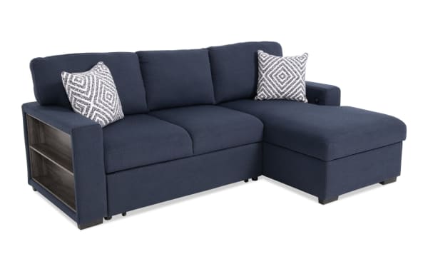 Playday Navy 93'' transitional 2-piece right-arm facing pop-up sleeper chaise sectional in blue polyester fabric with built-in bookshelf and patterned accent pillows.