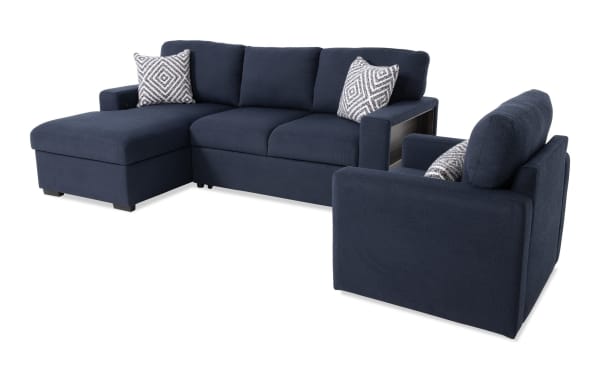 Playday Navy 93'' transitional 2-piece sectional with left-arm chaise, pop-up sleeper, built-in bookshelf, and swivel chair. Navy polyester fabric upholstery with memory foam cushions, accent pillows, storage chaise, drop-down table with cupholders, and Bluetooth audio.