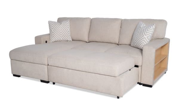 Beige Playday 93'' transitional 2-piece left-arm facing pop-up sleeper chaise sectional with polyester fabric, storage shelves, and plush cushions.