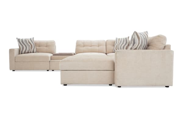 Beige Modular Bob® 129" 7-piece contemporary sectional sofa with polyester fabric, memory foam cushions, pet bed console, storage seats, and USB ports.