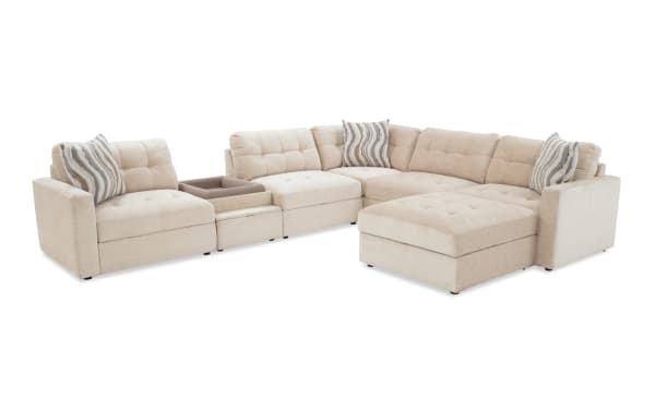 Beige Modular Bob® 7-piece contemporary fabric sectional with pet bed console, storage chairs, corner seat, and storage ottoman, featuring plush polyester upholstery and memory foam cushions.