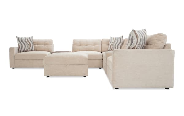 Beige Modular Bob® 129'' 8-piece contemporary sectional with polyester fabric upholstery, memory foam cushions, pet bed console, storage seats, and USB ports.