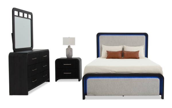 Cascade 4 Piece Twin Black & Beige Upholstered Panel Bedroom Set with plush beige polyester fabric, MDF frame, felt-lined drawers, USB ports, and LED lighting, featuring transitional style and intricate reeding details.