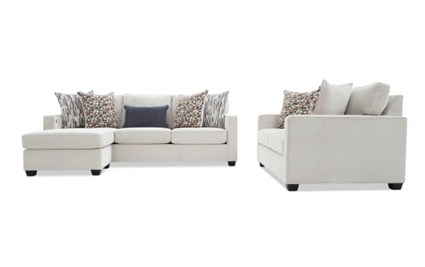 Beige fabric sectional sofa with chaise lounge, patterned and solid throw pillows, modern design, wooden legs, living room furniture.