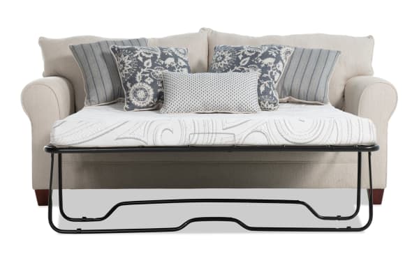 Beige Portland 85'' transitional sleeper sofa upholstered in soft polyester fabric, featuring rolled arms, patterned accent pillows, and a queen cooling gel memory foam mattress.