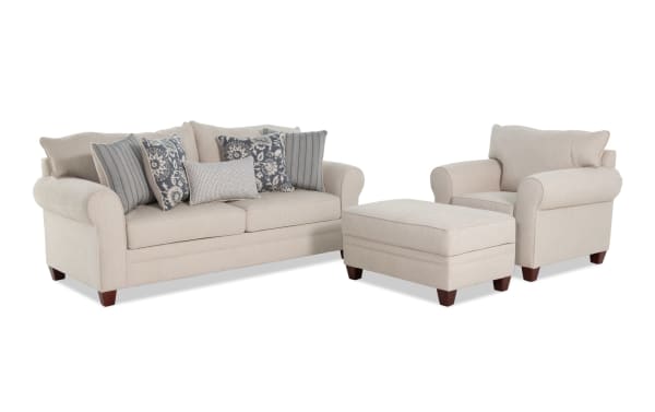 Portland Beige 85'' transitional sofa set with chair and storage ottoman, beige polyester fabric upholstery, includes patterned and striped accent pillows.