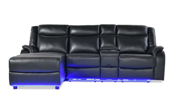 Prism Black 100'' Immersive Audio Power Reclining 2 Piece Left Arm Facing Sectional in black faux leather with LED lighting, power recline, and contemporary style.