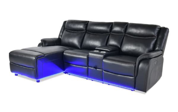 Prism Black 100'' Immersive Audio Power Reclining Left Arm Facing Sectional in black faux leather with Bluetooth speakers, LED lighting, USB ports, and power recline.