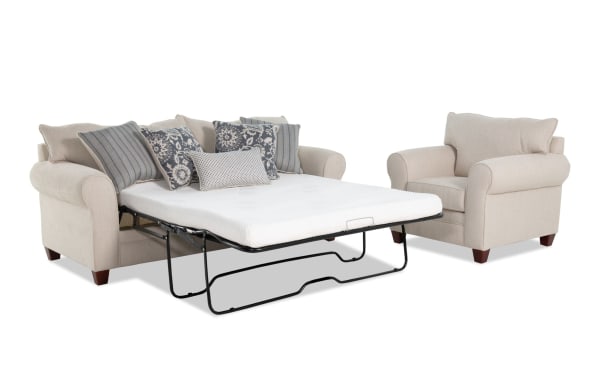 Portland Beige 85'' transitional sleeper sofa with queen gel memory foam mattress and matching beige fabric polyester chair, featuring rolled arms and accent pillows.