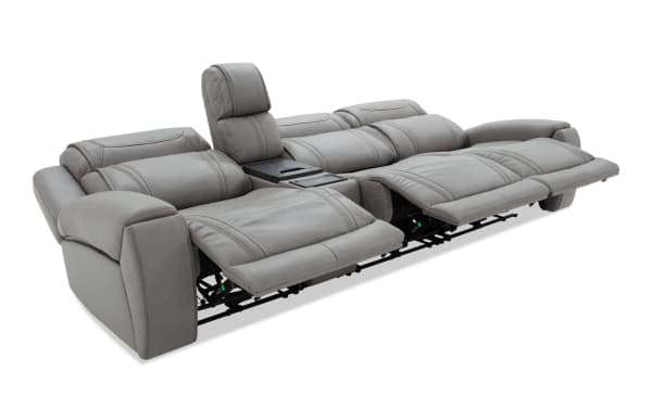 Dynamic Gray Leather 123'' Power Reclining 4 Piece Sofa from the Dynamic collection, featuring gray leather upholstery, armless recliner, USB and USB-C ports, independent power headrests, lay-flat reclining, and a center console with wireless charging and cup holders.