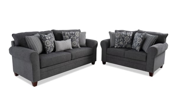 Portland Gray 85'' sofa and 65'' loveseat set in transitional style, gray polyester fabric upholstery with rolled arms and patterned accent pillows.
