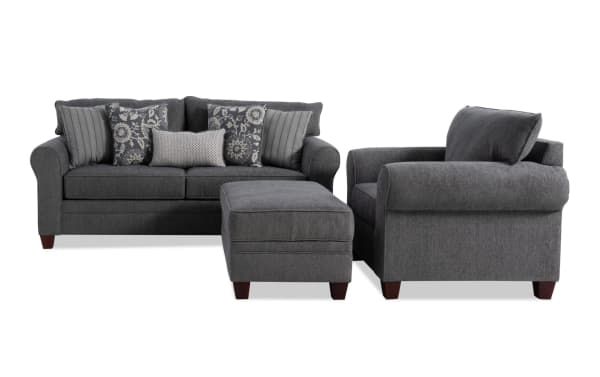 Portland Gray 85'' transitional sofa set with chair and storage ottoman, gray polyester fabric upholstery, includes patterned and striped accent pillows.