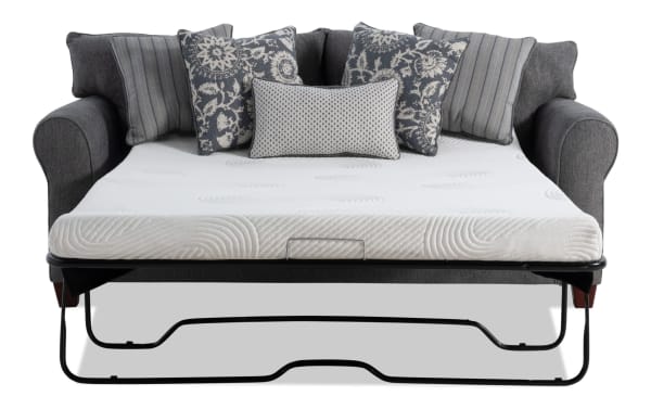Portland Gray 85'' transitional sleeper sofa with gray polyester fabric upholstery, queen gel memory foam mattress, and patterned accent pillows.