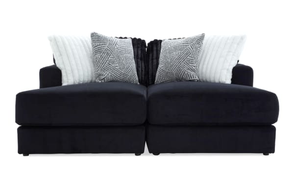 Sofia Black 78'' Dual Chaise sectional sofa in black polyester fabric with transitional style, featuring plush channel tufted back cushions and four faux fur pillows for luxury and comfort.
