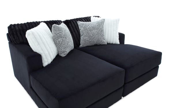Sofia Black 78'' Dual Chaise sectional sofa in black polyester fabric with channel tufted back cushions and four faux fur pillows, transitional style.