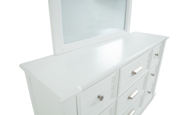 Sunset Cove White 9 Drawer Dresser & Mirror in coastal style, made of white MDF with slatted drawer fronts and mixed metal handles.