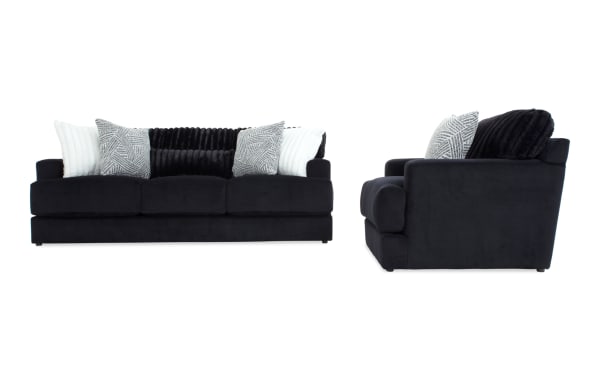 Contemporary Sofia Black 93'' Sofa & Chair set in black polyester fabric with channel tufted back cushions, accent pillows, and memory foam for comfort.