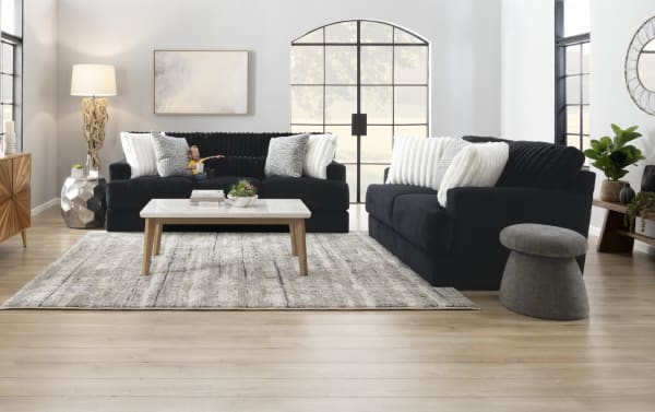 Contemporary Sofia Black 93'' Sofa & Chair set in black polyester fabric with channel tufted seat back cushions and accent pillows.