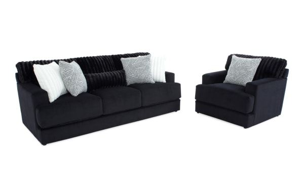 Contemporary Sofia Black 93'' Sofa & Chair set in black polyester fabric with channel tufted back cushions, accent pillows, and Bob-O-Pedic Memory Foam for added comfort.