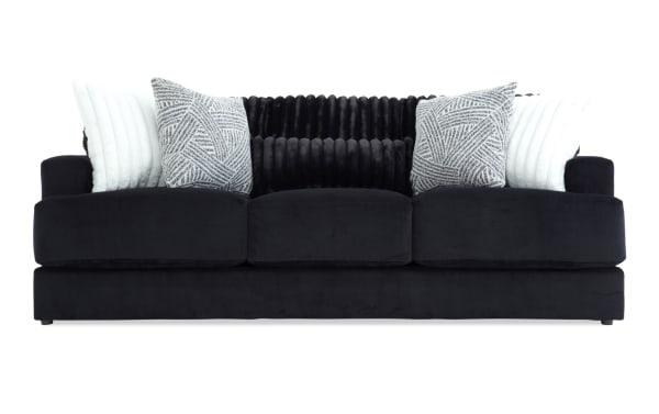 Contemporary Sofia Black 93'' Sofa with plush black polyester fabric upholstery, channel tufted back cushions, and patterned accent pillows for luxury and comfort.