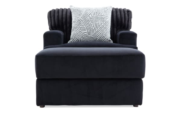 Contemporary Sofia Black Chair & Ottoman with channel tufted back, plush black polyester fabric, and memory foam cushioning for ultimate comfort.