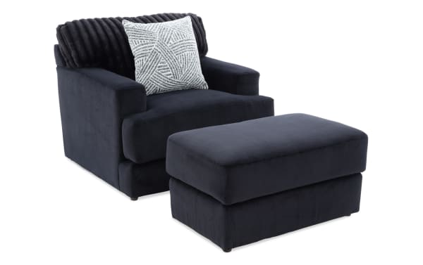 Contemporary Sofia Black Chair & Ottoman set in soft black polyester fabric with channel tufted back and memory foam cushions for luxury comfort.