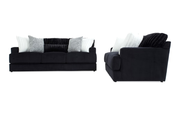 Contemporary Sofia Black 93'' Sofa and 70'' Loveseat set in black polyester fabric with channel tufted back cushions and accent pillows, featuring Bob-O-Pedic Memory Foam for enhanced comfort.
