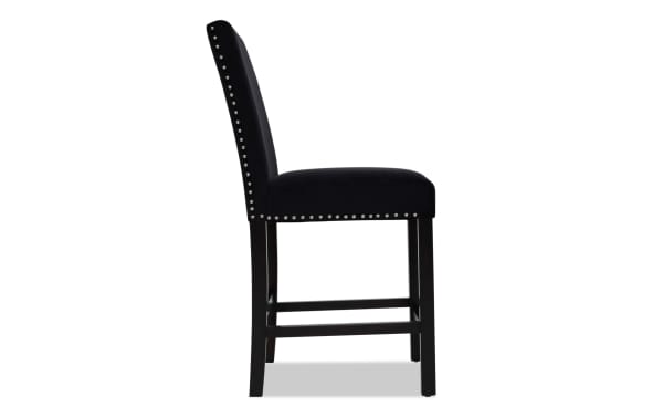 Black upholstered bar stool with silver nailhead trim along the backrest and seat edge, featuring dark wooden legs and footrest.