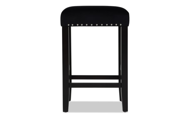 Black wooden bar stool with a cushioned black velvet seat, silver nailhead trim, and sturdy square legs with footrests.